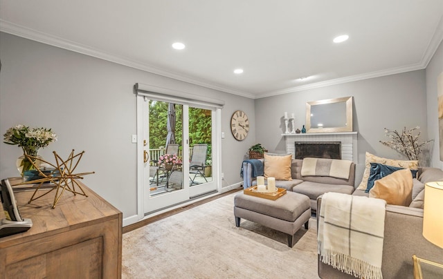90 Gannet Dr, Commack, NY 11725 - living area featuring recessed lighting, crown molding, a brick fireplace, baseboards, and wood finished floors