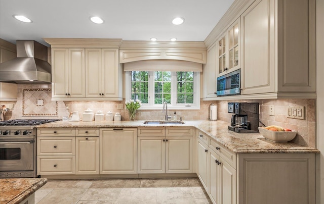 90 Gannet Dr, Commack, NY 11725 - kitchen with a sink, appliances with stainless steel finishes, wall chimney range hood, cream cabinets, and light stone counters