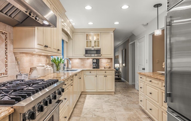 90 Gannet Dr, Commack, NY 11725 - kitchen with high quality appliances, cream cabinets, wall chimney range hood, a sink, and recessed lighting