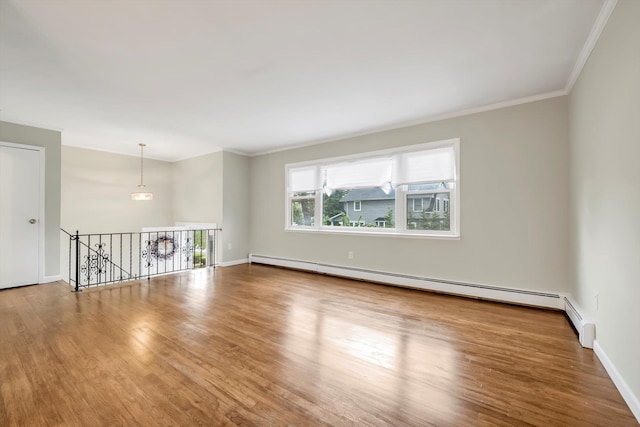 76 Melrose Ave, Lynbrook, NY 11563 - unfurnished room featuring a baseboard radiator, crown molding, wood finished floors, and baseboards