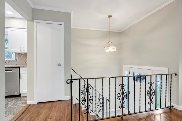 76 Melrose Ave, Lynbrook, NY 11563 - stairs with crown molding, wood finished floors, and baseboards