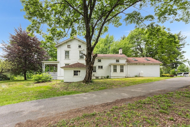 3 Losee Rd, Wappingers Falls, NY 12590 - view of front facade with a chimney and a front lawn