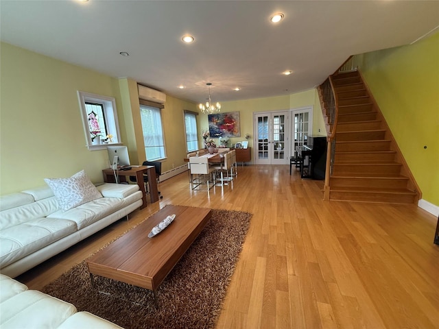 83-46 Penelope Ave, Middle Village, NY 11379 - living room with a chandelier, stairway, french doors, light wood-style floors, and recessed lighting