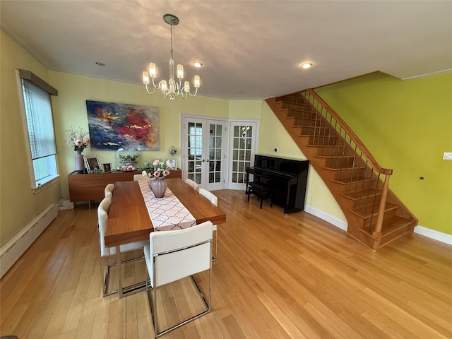 83-46 Penelope Ave, Middle Village, NY 11379 - dining space with stairs, french doors, a chandelier, light wood-style flooring, and baseboards
