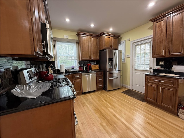 83-46 Penelope Ave, Middle Village, NY 11379 - kitchen with stainless steel appliances, tasteful backsplash, light wood-style floors, plenty of natural light, and recessed lighting