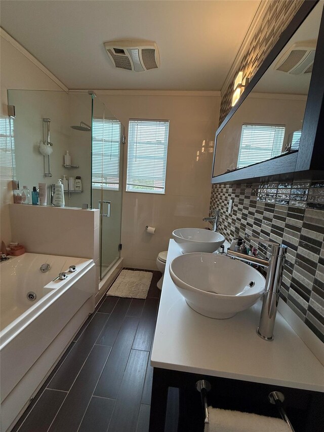 83-46 Penelope Ave, Middle Village, NY 11379 - bathroom with healthy amount of natural light, tasteful backsplash, a jetted tub, ornamental molding, and a stall shower
