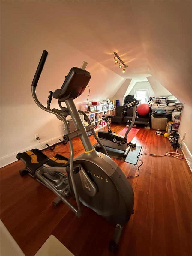 83-46 Penelope Ave, Middle Village, NY 11379 - exercise room with lofted ceiling, wood-type flooring, and baseboards