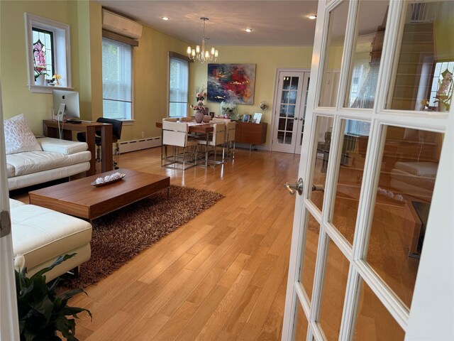 83-46 Penelope Ave, Middle Village, NY 11379 - living room with a chandelier, baseboard heating, light wood-style floors, and recessed lighting