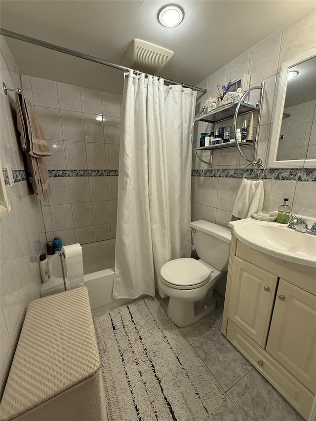 83-46 Penelope Ave, Middle Village, NY 11379 - bathroom featuring tile walls, tile patterned flooring, toilet, shower / tub combo, and vanity