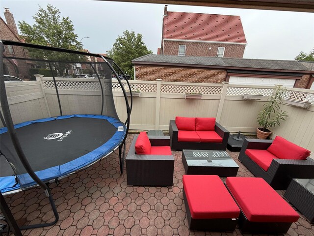 83-46 Penelope Ave, Middle Village, NY 11379 - view of patio / terrace with a trampoline, a fenced backyard, and an outdoor hangout area