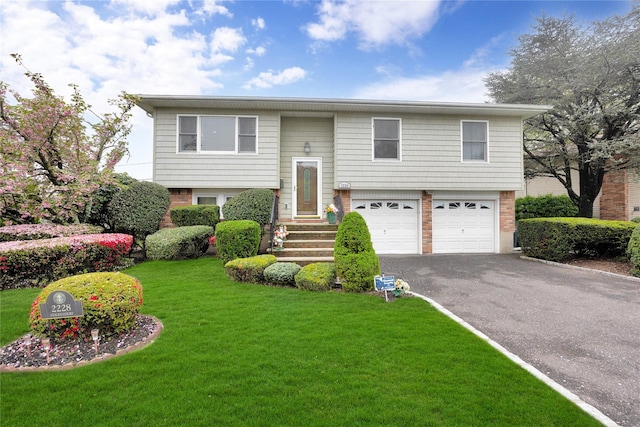 2228 Stacey Ct, North Bellmore, NY 11710 - bi-level home with asphalt driveway, an attached garage, brick siding, and a front yard