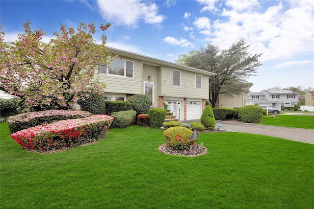2228 Stacey Ct, North Bellmore, NY 11710 - split foyer home with an attached garage, a front yard, and driveway