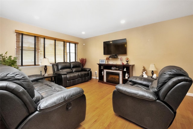 2228 Stacey Ct, North Bellmore, NY 11710 - living area with light wood-type flooring, baseboards, a fireplace with flush hearth, and recessed lighting
