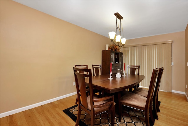 2228 Stacey Ct, North Bellmore, NY 11710 - dining area featuring light wood-style flooring and baseboards