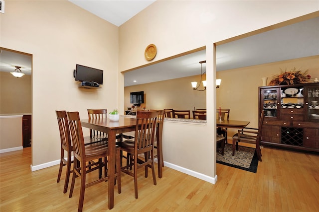 2228 Stacey Ct, North Bellmore, NY 11710 - dining space with wood finished floors, baseboards, and a high ceiling
