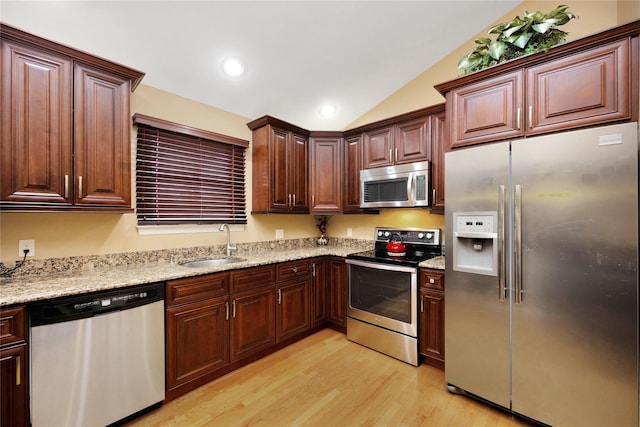 2228 Stacey Ct, North Bellmore, NY 11710 - kitchen featuring appliances with stainless steel finishes, a sink, light wood finished floors, vaulted ceiling, and recessed lighting
