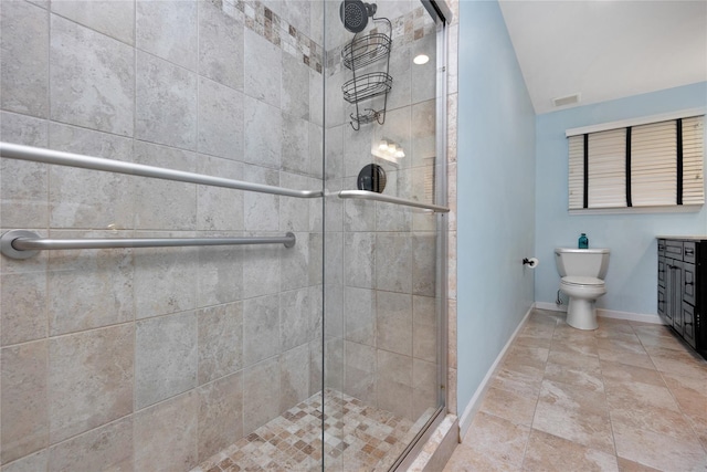 2228 Stacey Ct, North Bellmore, NY 11710 - bathroom featuring a shower stall, vaulted ceiling, baseboards, toilet, and vanity