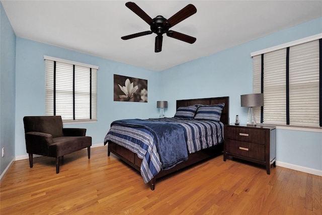 2228 Stacey Ct, North Bellmore, NY 11710 - bedroom with light wood finished floors, baseboards, and a ceiling fan