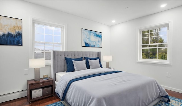 2155 Walton Ave, Bronx, NY 10453 - bedroom with a baseboard heating unit, dark wood-style flooring, recessed lighting, and baseboards