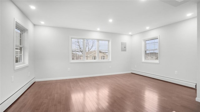 2155 Walton Ave, Bronx, NY 10453 - empty room with baseboard heating, a baseboard radiator, wood finished floors, healthy amount of natural light, and recessed lighting