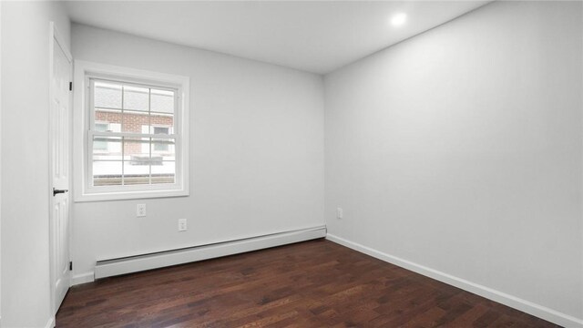 2155 Walton Ave, Bronx, NY 10453 - spare room featuring a baseboard radiator, wood finished floors, baseboards, and recessed lighting
