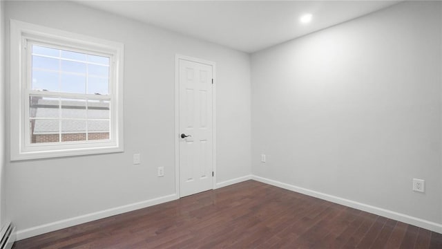 2155 Walton Ave, Bronx, NY 10453 - empty room featuring dark wood-type flooring, baseboards, a baseboard heating unit, and recessed lighting