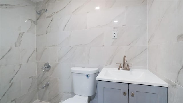 2155 Walton Ave, Bronx, NY 10453 - bathroom with vanity, a tile shower, toilet, and tile walls