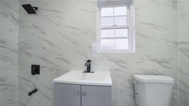 2155 Walton Ave, Bronx, NY 10453 - bathroom with vanity, tile walls, and toilet