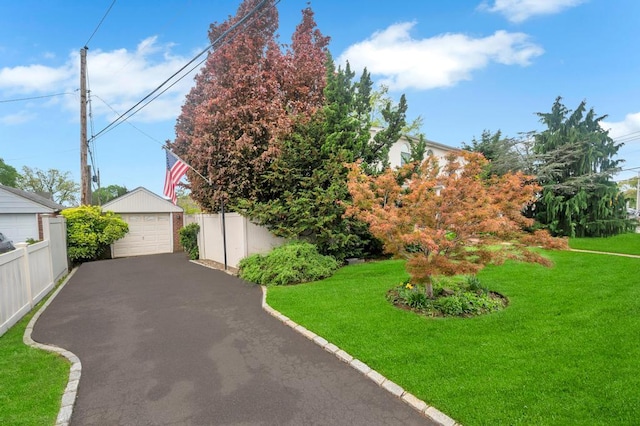 2346 Post St, East Meadow, NY 11554 - obstructed view of property featuring a garage and an outdoor structure