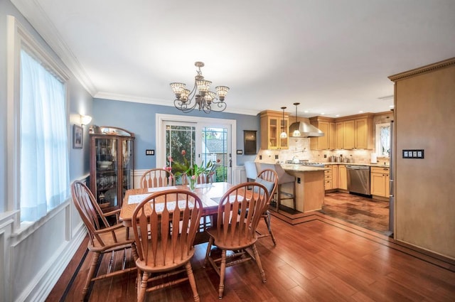 2346 Post St, East Meadow, NY 11554 - dining space featuring a chandelier, dark wood-style floors, crown molding, and wainscoting