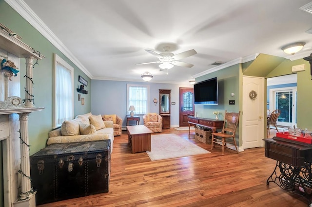 2346 Post St, East Meadow, NY 11554 - living room with light wood-style floors, crown molding, and ceiling fan