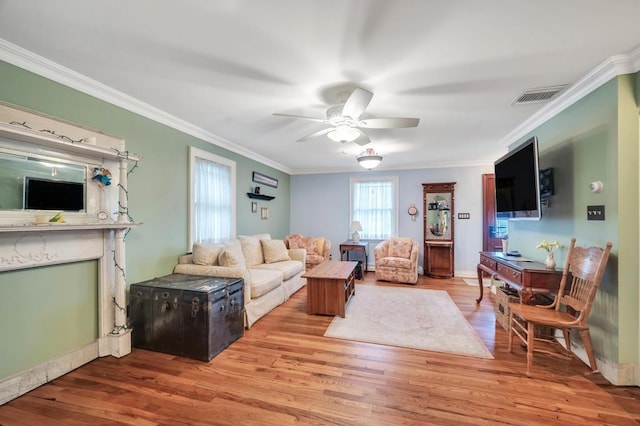 2346 Post St, East Meadow, NY 11554 - living area featuring a ceiling fan, ornamental molding, and wood finished floors
