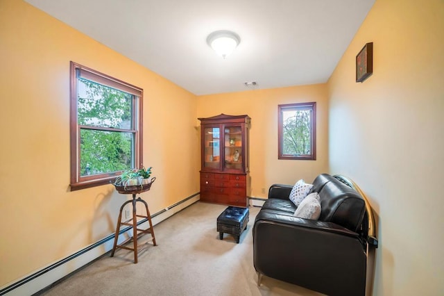 2346 Post St, East Meadow, NY 11554 - living area featuring baseboard heating, plenty of natural light, and light colored carpet