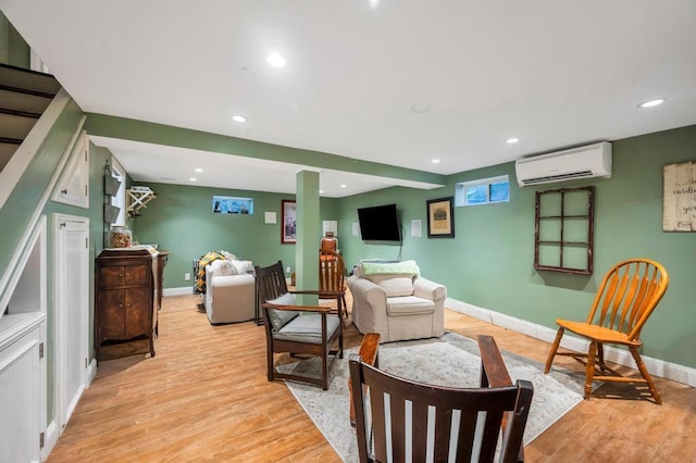 2346 Post St, East Meadow, NY 11554 - sitting room with a wall mounted AC, recessed lighting, light wood-type flooring, and baseboards