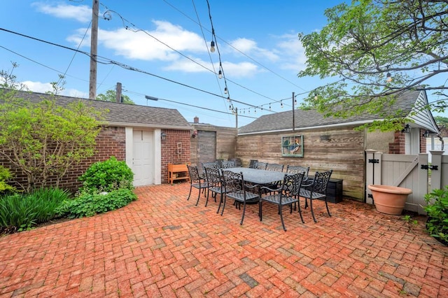 2346 Post St, East Meadow, NY 11554 - view of patio with a gate, fence, and outdoor dining space