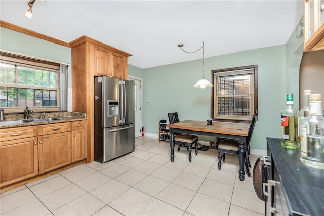 2733 Tenbroeck Ave, Bronx, NY 10469 - kitchen featuring stainless steel fridge, a sink, light tile patterned flooring, an office area, and brown cabinets