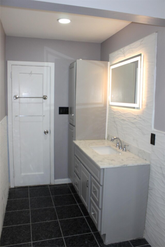 1535 Mattison St, Baldwin, NY 11510 - bathroom with tile walls, vanity, tile patterned floors, and recessed lighting