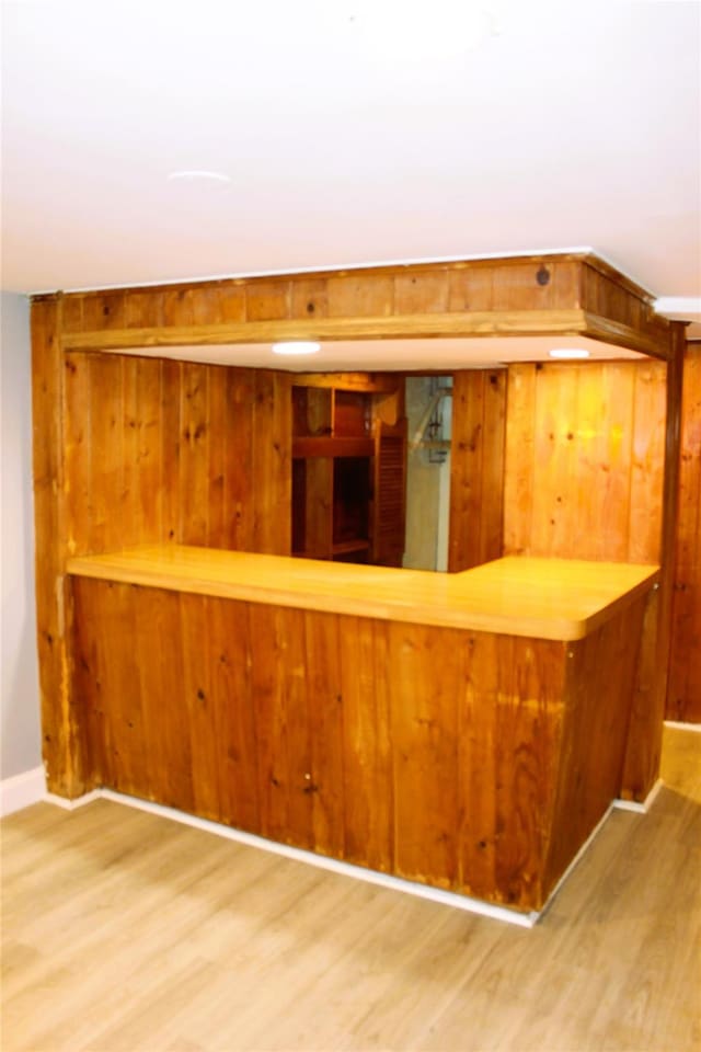 1535 Mattison St, Baldwin, NY 11510 - bar area with wood finished floors, wood walls, and baseboards