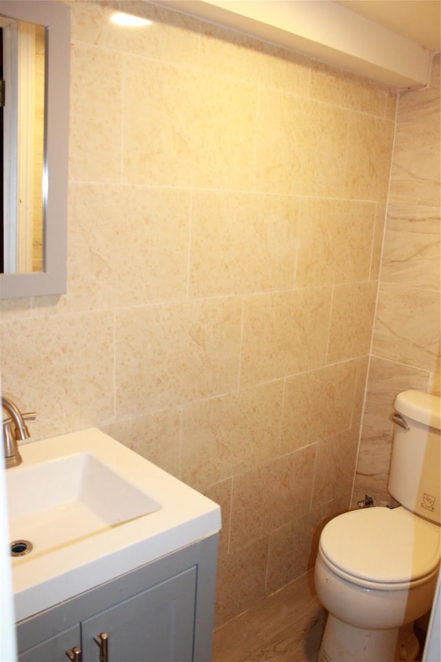 1535 Mattison St, Baldwin, NY 11510 - bathroom with tile walls, vanity, and toilet