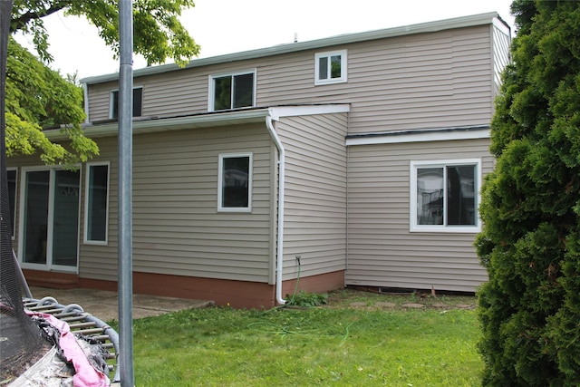 1535 Mattison St, Baldwin, NY 11510 - rear view of property with a yard