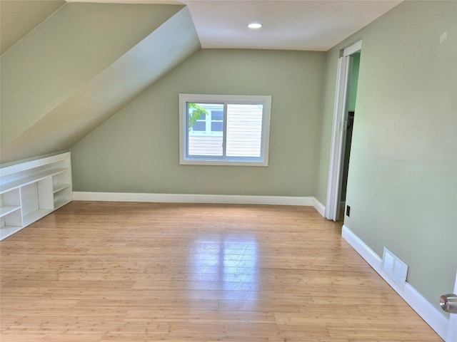 1535 Mattison St, Baldwin, NY 11510 - additional living space with lofted ceiling, light wood finished floors, baseboards, and recessed lighting