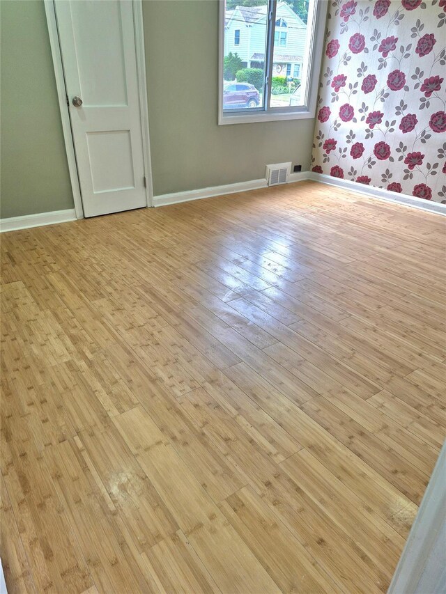1535 Mattison St, Baldwin, NY 11510 - unfurnished room featuring hardwood / wood-style flooring and baseboards