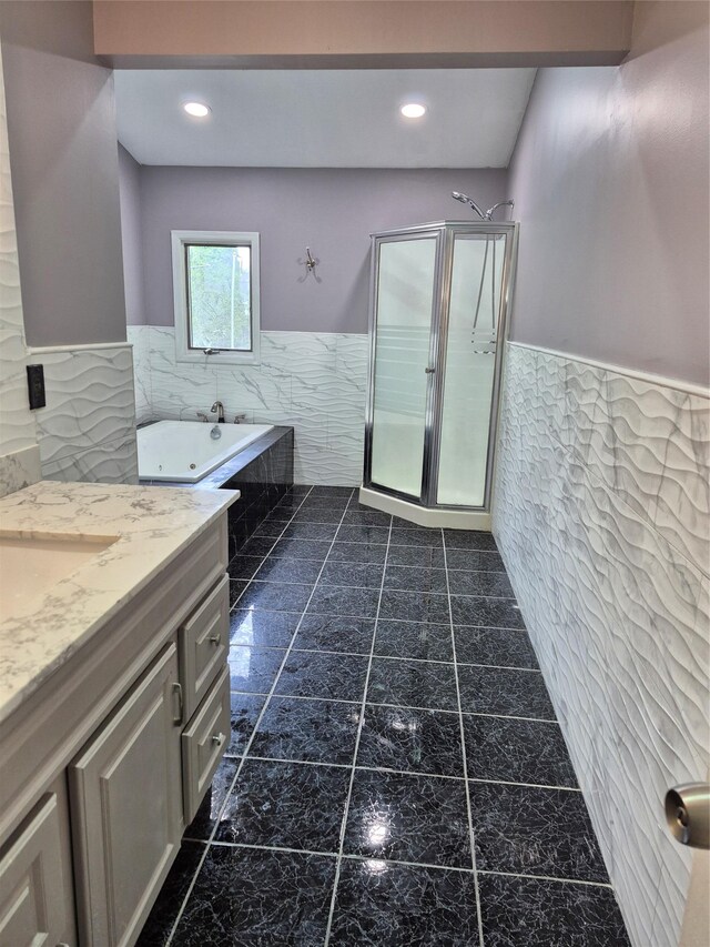 1535 Mattison St, Baldwin, NY 11510 - full bath with tile walls, a wainscoted wall, a jetted tub, vanity, and a shower stall