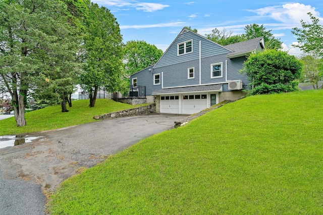 20 Idlewild Park Dr, Cornwall On Hudson, NY 12520 - view of front of home with driveway, a front lawn, an attached garage, and a cooling unit