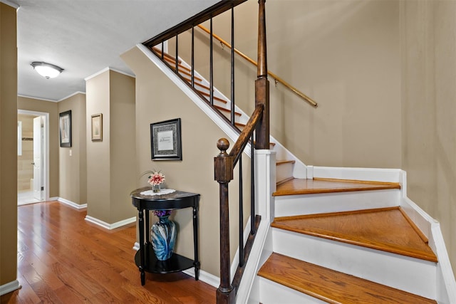 20 Idlewild Park Dr, Cornwall On Hudson, NY 12520 - stairs featuring wood finished floors, ornamental molding, and baseboards