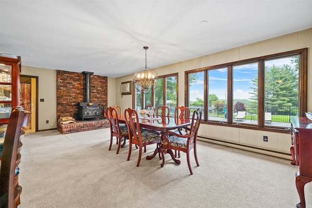 20 Idlewild Park Dr, Cornwall On Hudson, NY 12520 - dining room featuring plenty of natural light, a baseboard heating unit, a wood stove, and light colored carpet