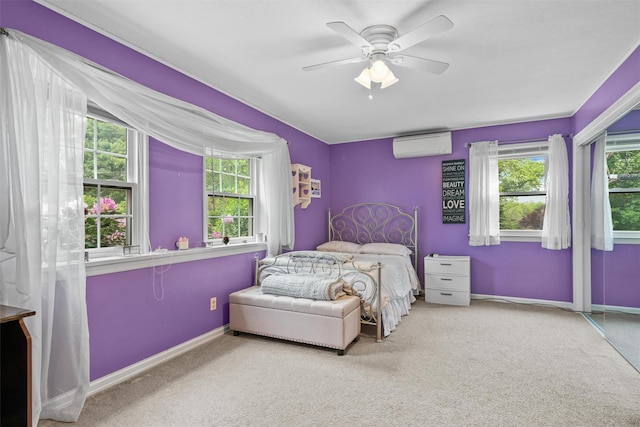 20 Idlewild Park Dr, Cornwall On Hudson, NY 12520 - carpeted bedroom featuring a wall unit AC, baseboards, and ceiling fan