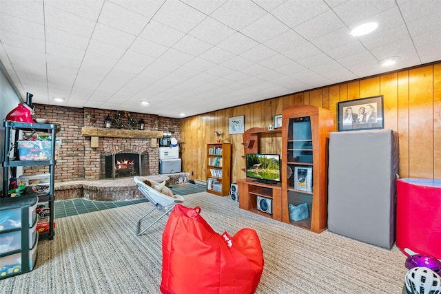 20 Idlewild Park Dr, Cornwall On Hudson, NY 12520 - carpeted living area with a brick fireplace, wooden walls, and recessed lighting