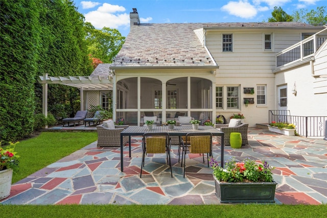 rear view of house featuring a pergola, a patio, a sunroom, a chimney, and outdoor dining space