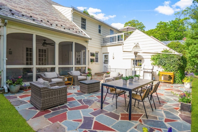 view of patio / terrace featuring an outdoor living space, a ceiling fan, and area for grilling